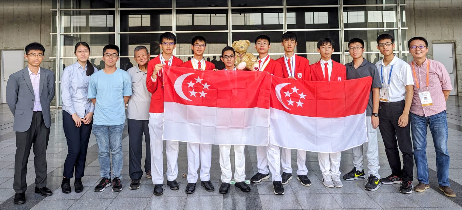 A group of people holding flags

Description automatically generated