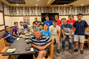 A group of people posing for a photo

Description automatically generated